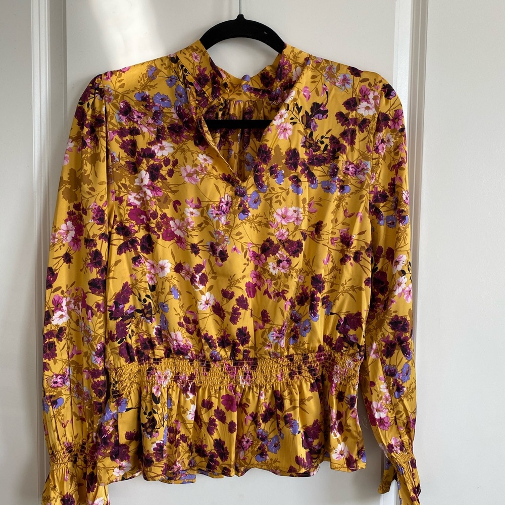 Scoop mock neck top with peplum waist